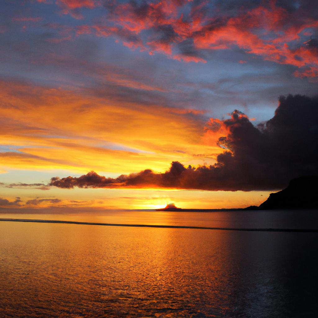 A breathtaking sunset over the horizon of Bora Bora's turquoise waters