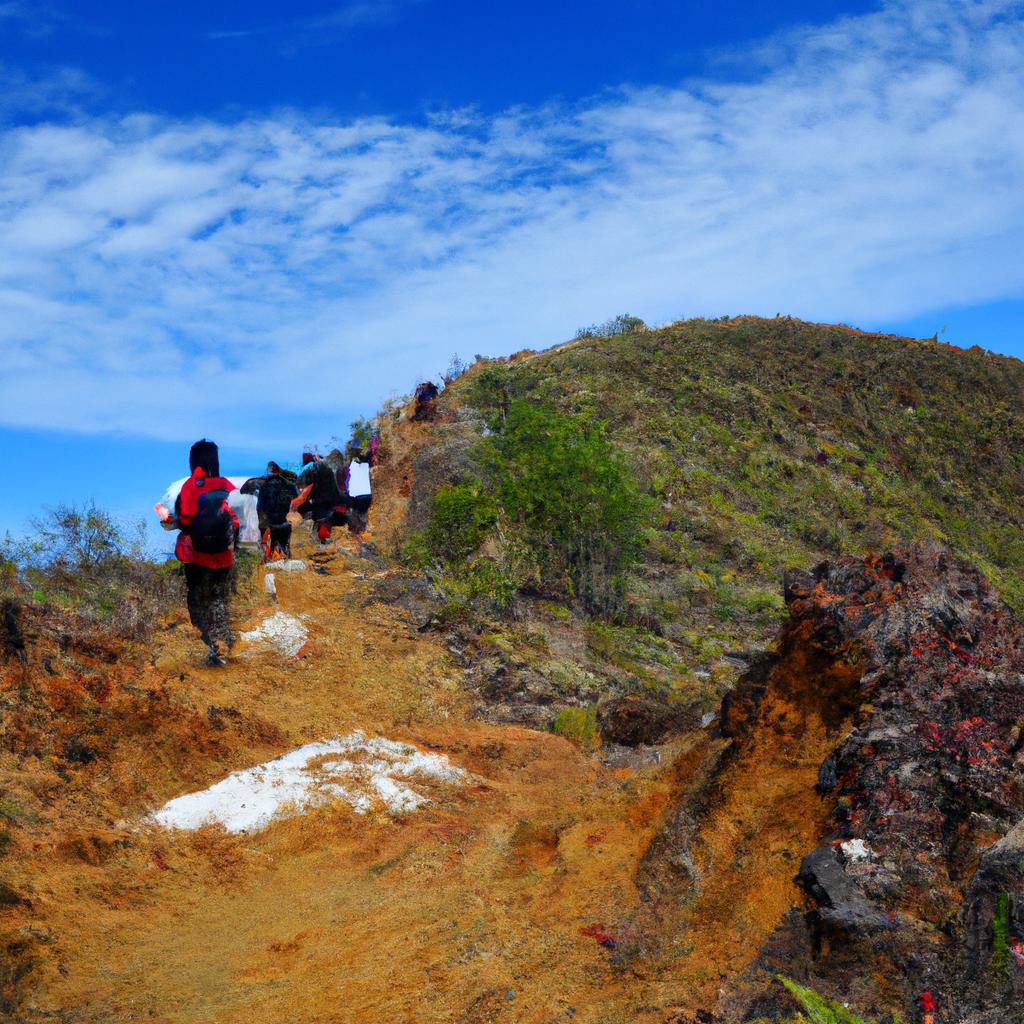 Hiking up to the summit of Kelimutu is a popular activity for adventurous visitors, offering breathtaking views of the surrounding landscape.