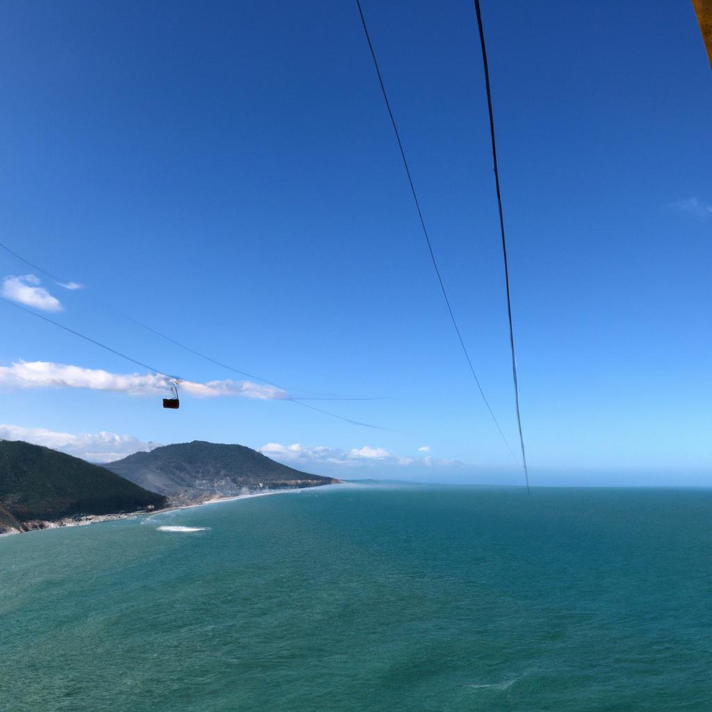 Experience the thrill of a cable car ride while enjoying the breathtaking view of the ocean.