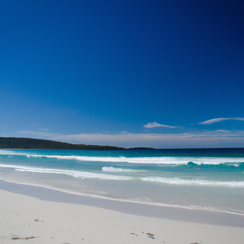 The calm waves and white sand beach in Australia