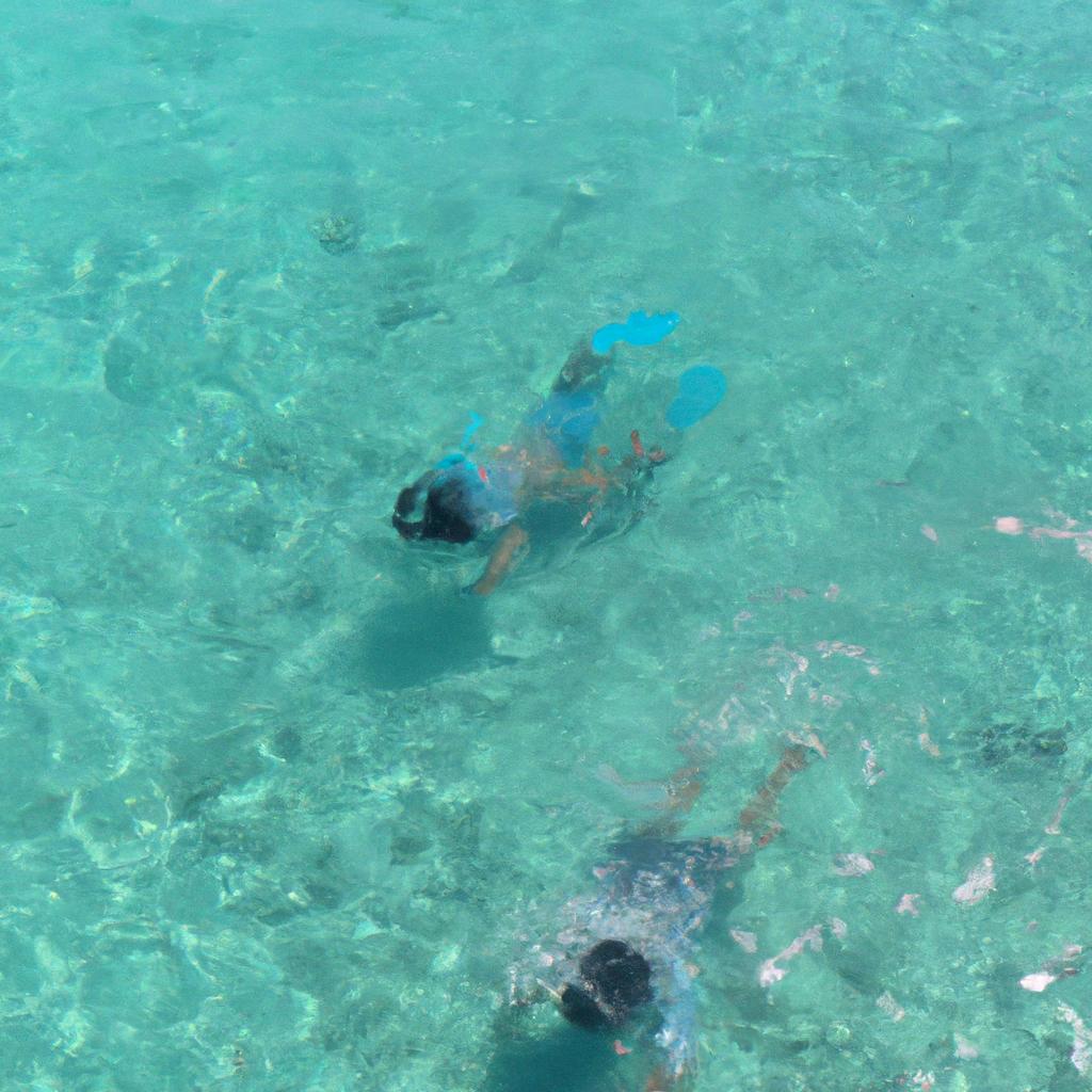 A couple enjoying the clear waters of Moon Beach in Milos, Greece