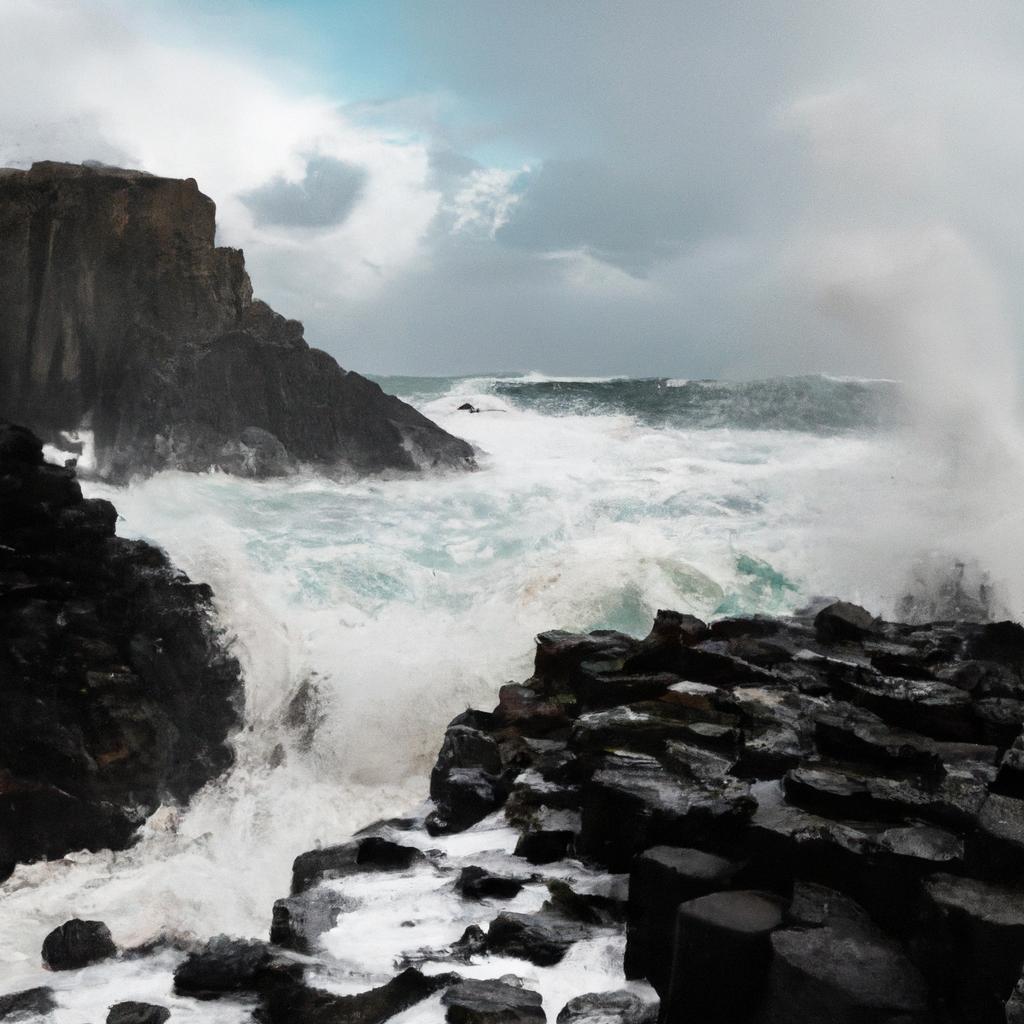 Witness the raw power of the ocean as it battles against the immovable basalt columns along the rugged coastline