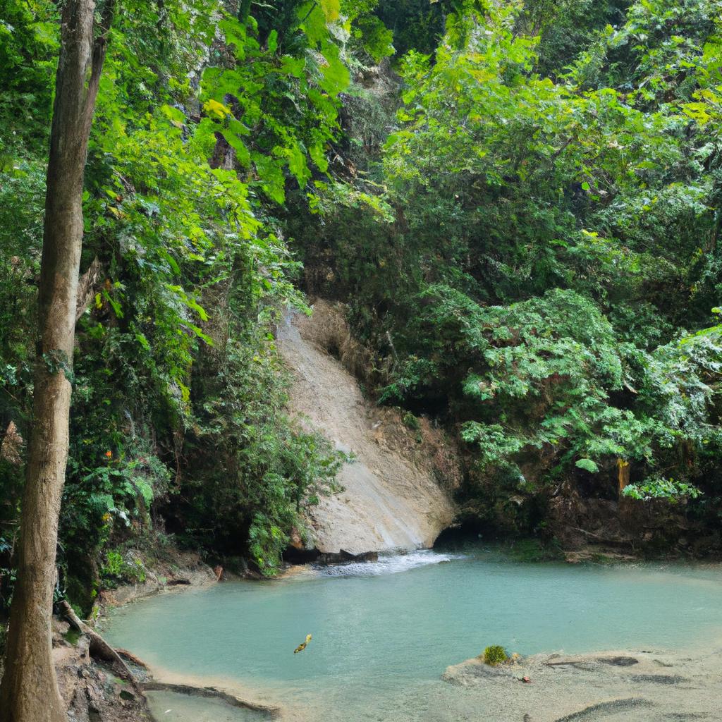 The lush greenery surrounding the Erawan Falls adds to its natural charm