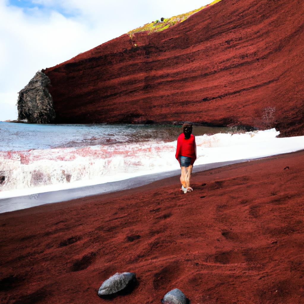 Visitors can walk along the beach and admire the stunning red sand.