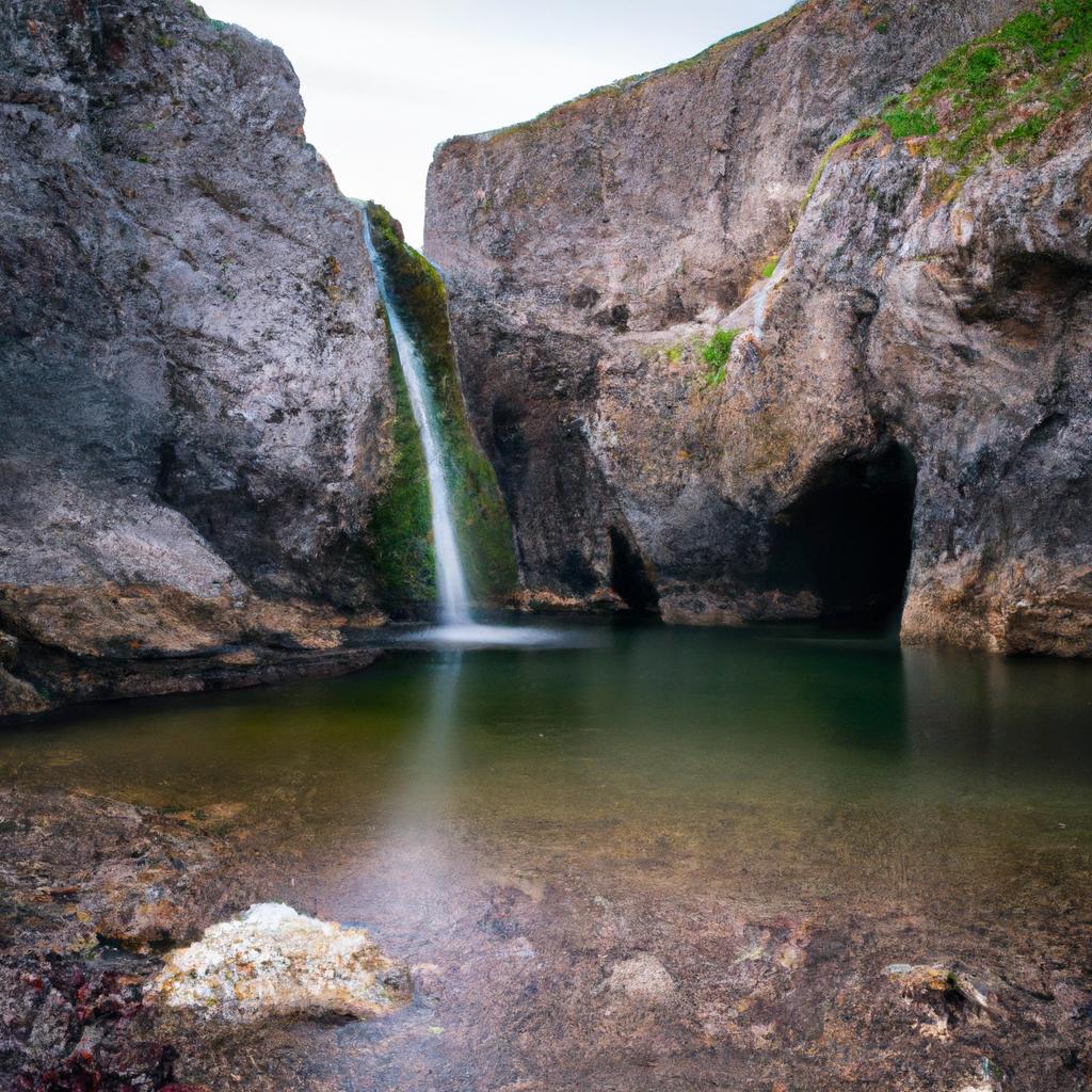 The rugged cliffs add an element of adventure to the already mysterious waterfall
