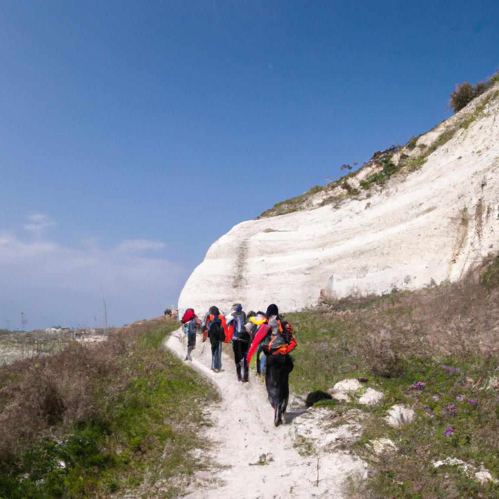 Hikers traverse the scenic trails of the Sicily White Cliffs, enjoying the stunning views of the Mediterranean Sea