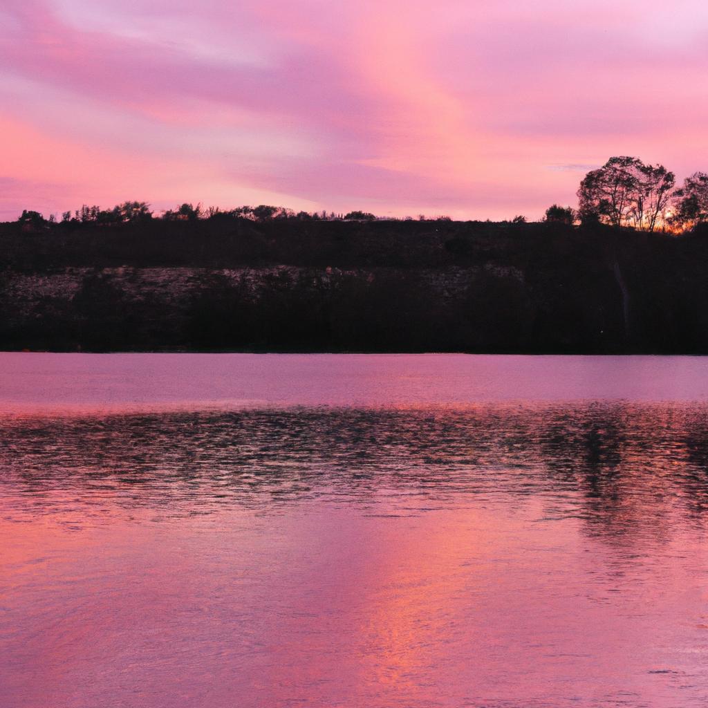 Sunsets at Hillier Lake are a breathtaking sight, as the pink waters reflect the warm colors of the sky.