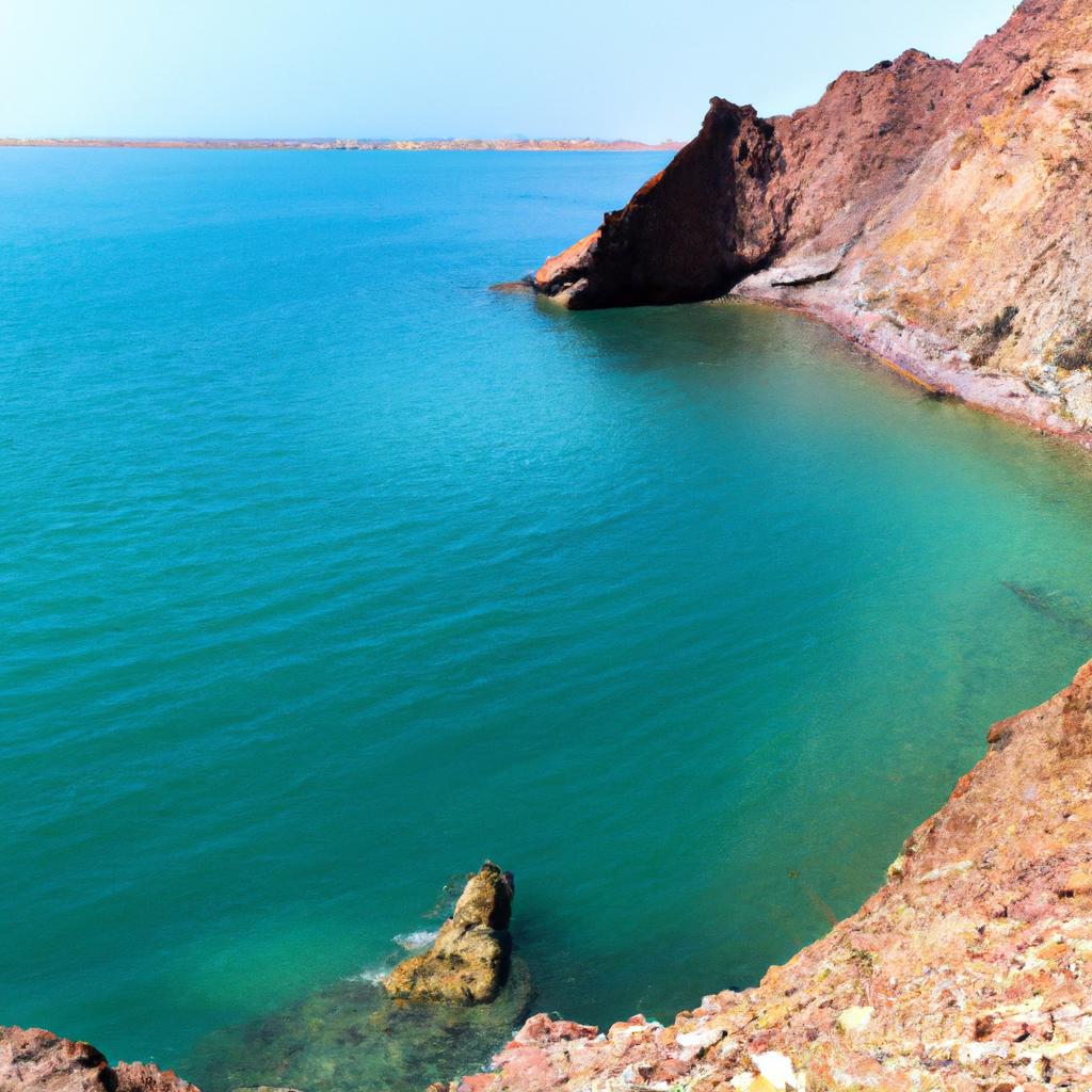 Take in the stunning scenery of Hormuz Island's rocky terrain and crystal blue waters.