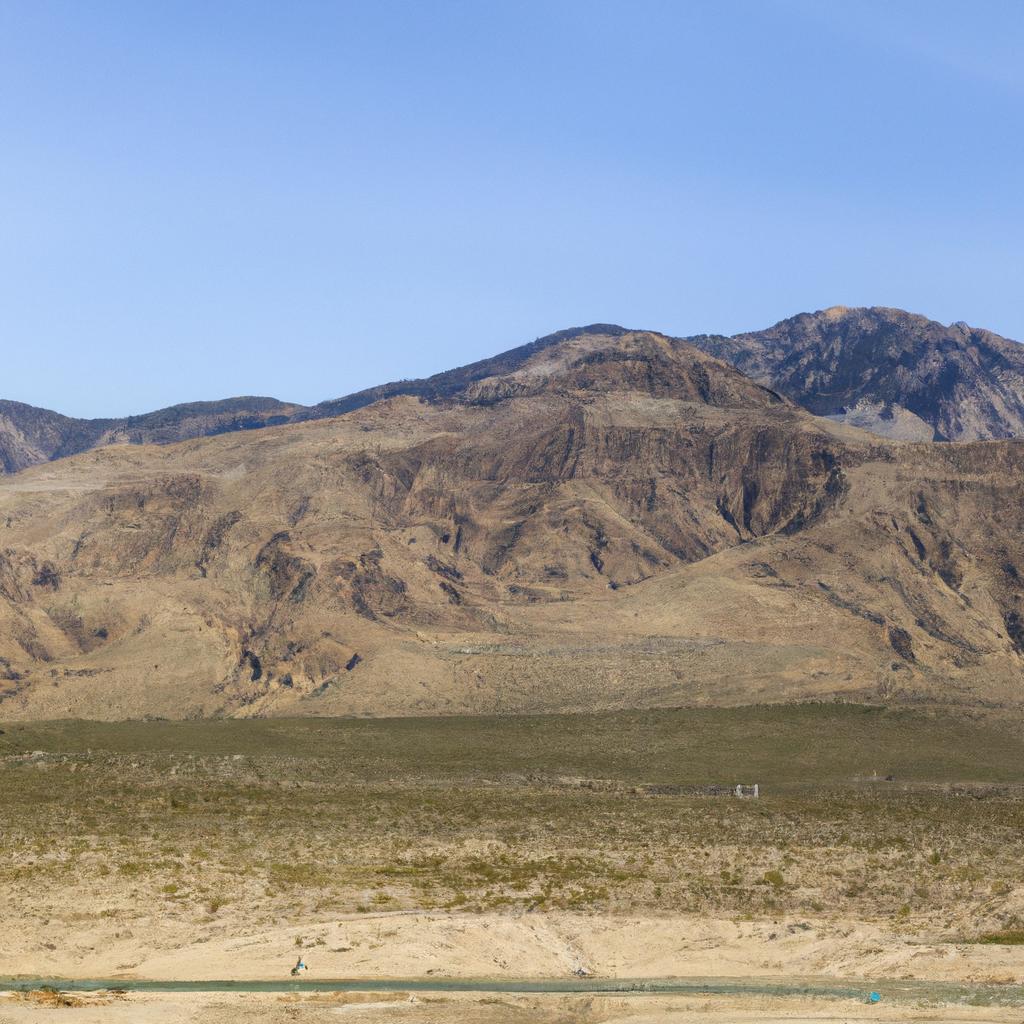 The rugged terrain of Nevada's mountains lines the horizon next to I-95