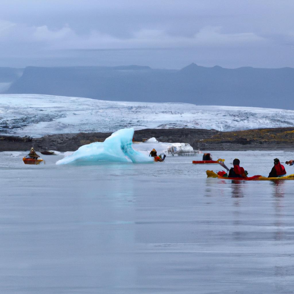 Tourists kayaking among the icebergs in the Jokulsarlon Glacier Lagoon.