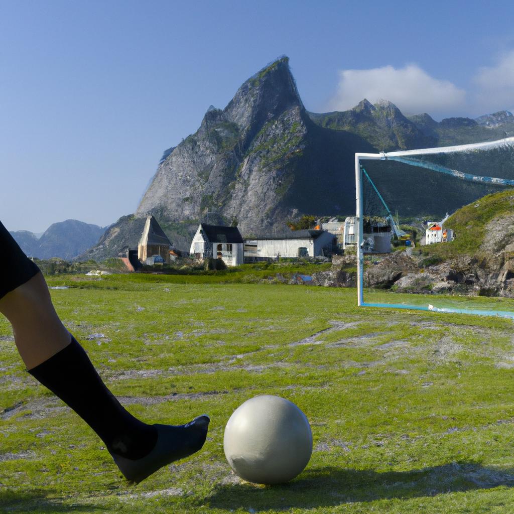 A soccer player kicks the ball during a match on the Lofoten soccer field