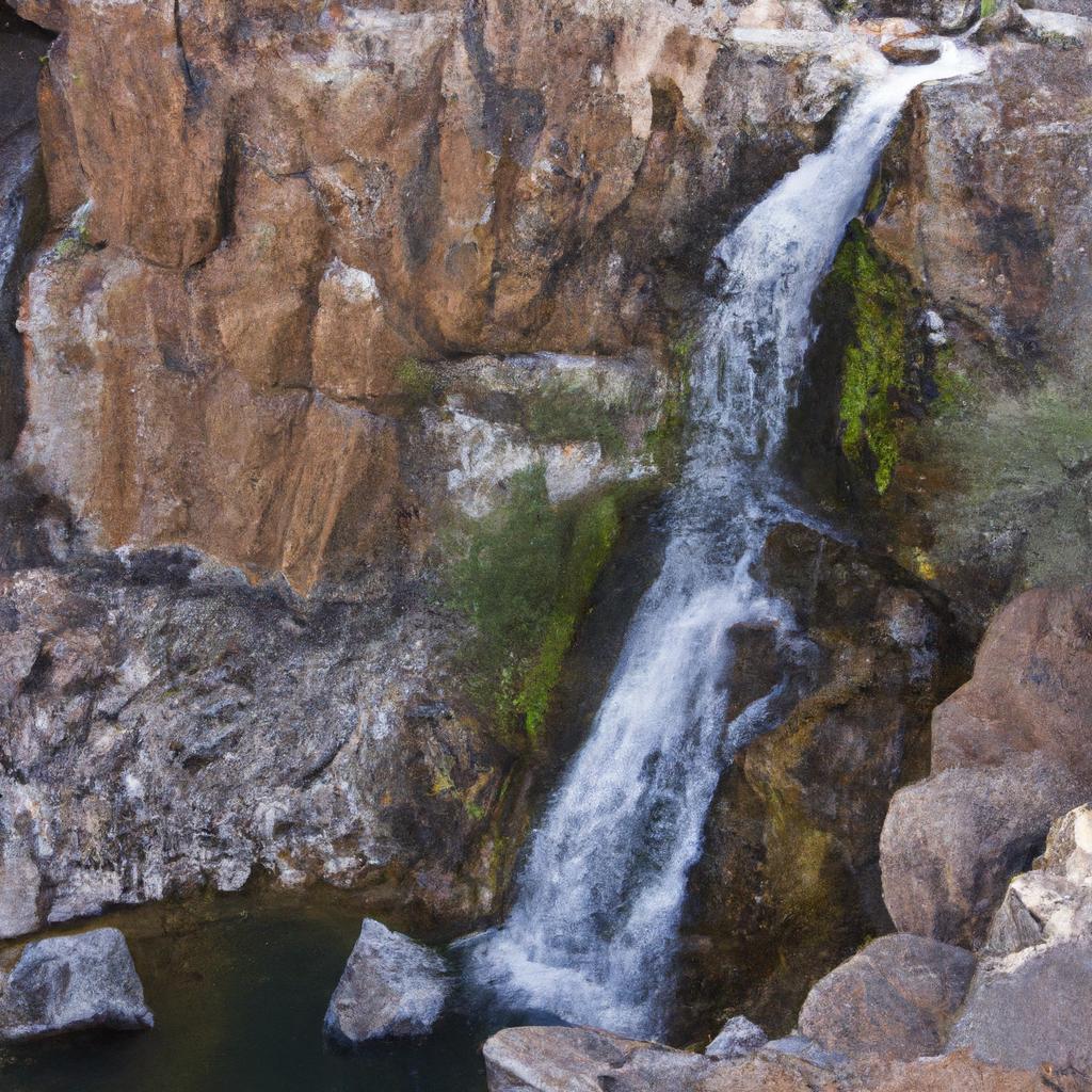 Nature's beauty at its finest. A majestic waterfall flowing down a rocky terrain in Arizona's Indian reservation.