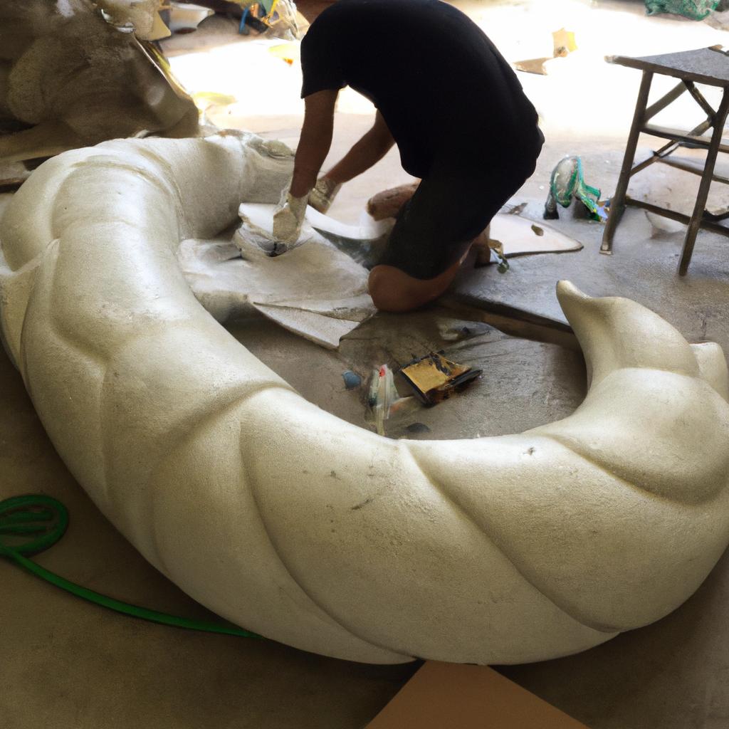 Sculptors carefully crafting the Titanoboa sculpture with precision