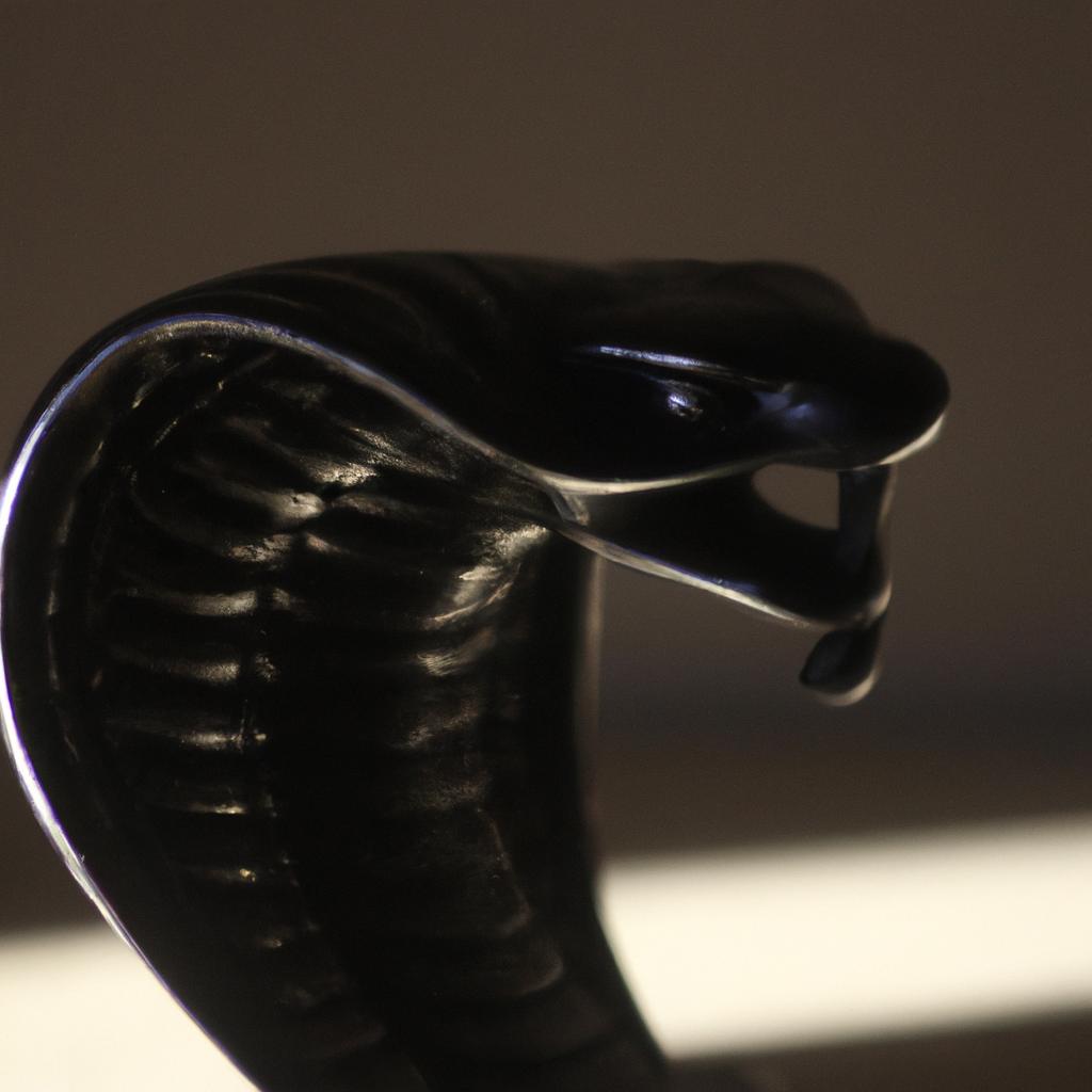 The menacing pose of this metal snake sculpture makes it a bold statement piece