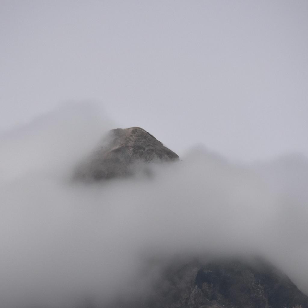The misty mountain peak creates an eerie and mysterious atmosphere, reminiscent of the legends of giants in the mountains