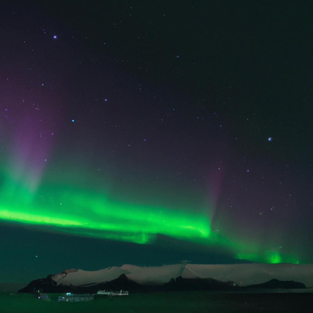 The mesmerizing Northern Lights dance above the Jokulsarlon Glacier Lagoon.