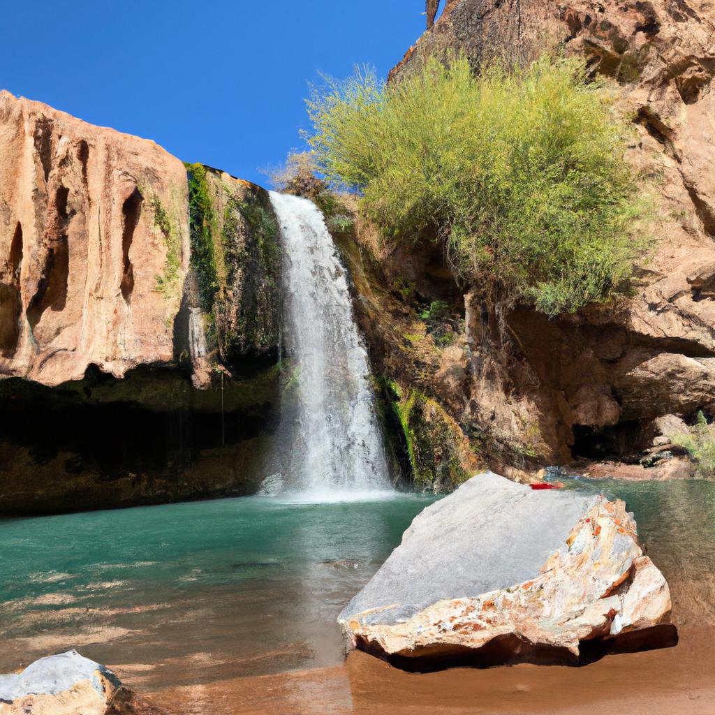 Experience the refreshing oasis amidst the desert with this beautiful waterfall in Arizona's Indian reservation.
