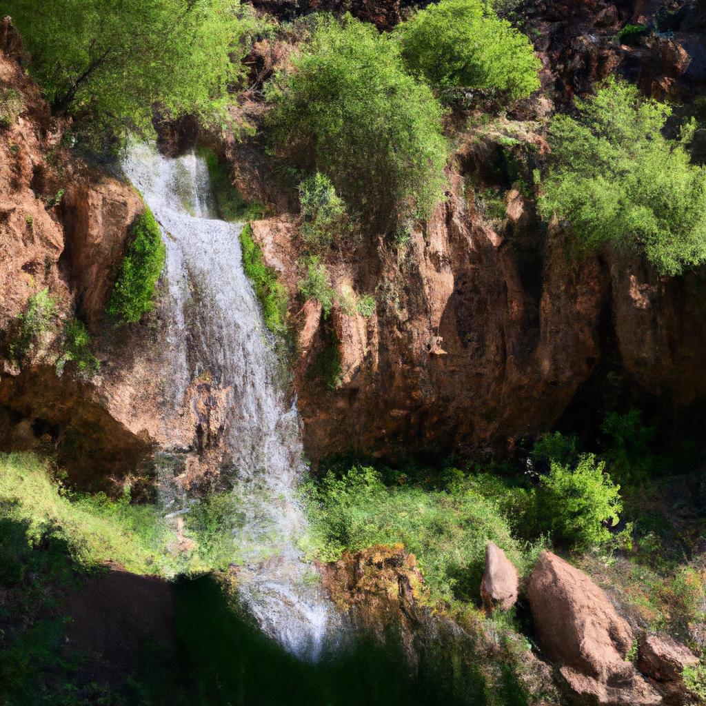 The lush greenery surrounding the picturesque waterfall in Arizona's Indian reservation is a sight to behold.