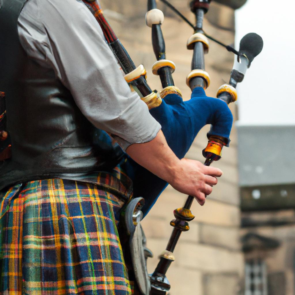 The sound of bagpipes fills the air as a street performer entertains tourists on the bustling Royal Mile.