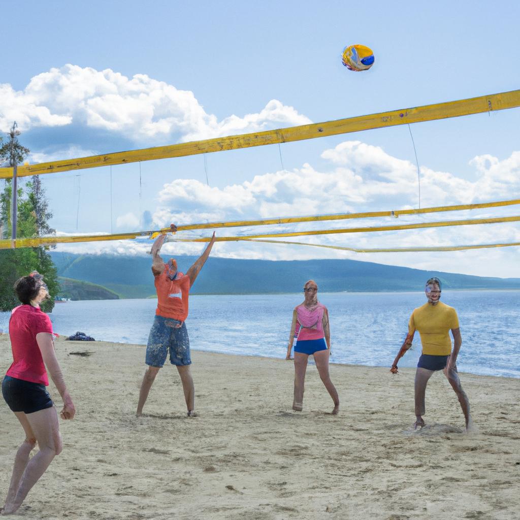 Friends having fun playing beach volleyball on Russia Kaleidoscope Beach