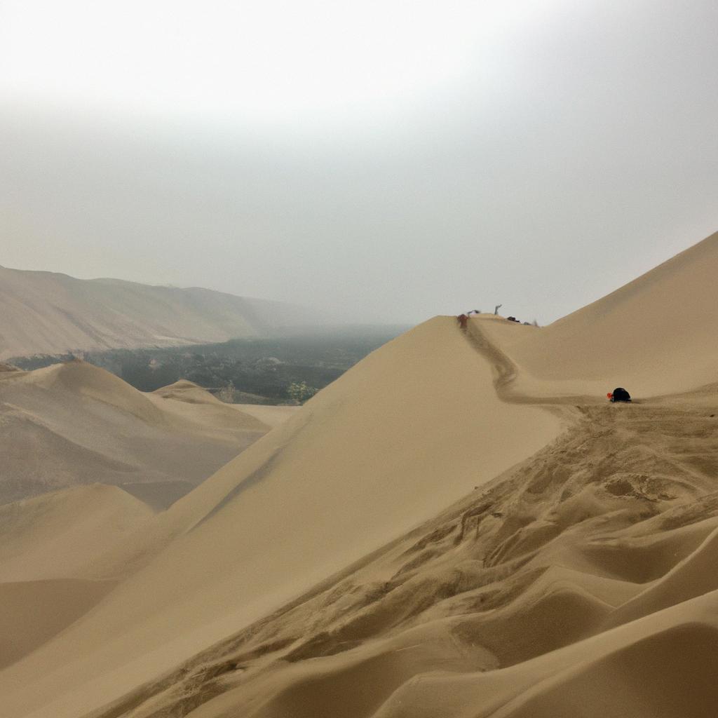 Riding the sand dunes of Huacachina on a board