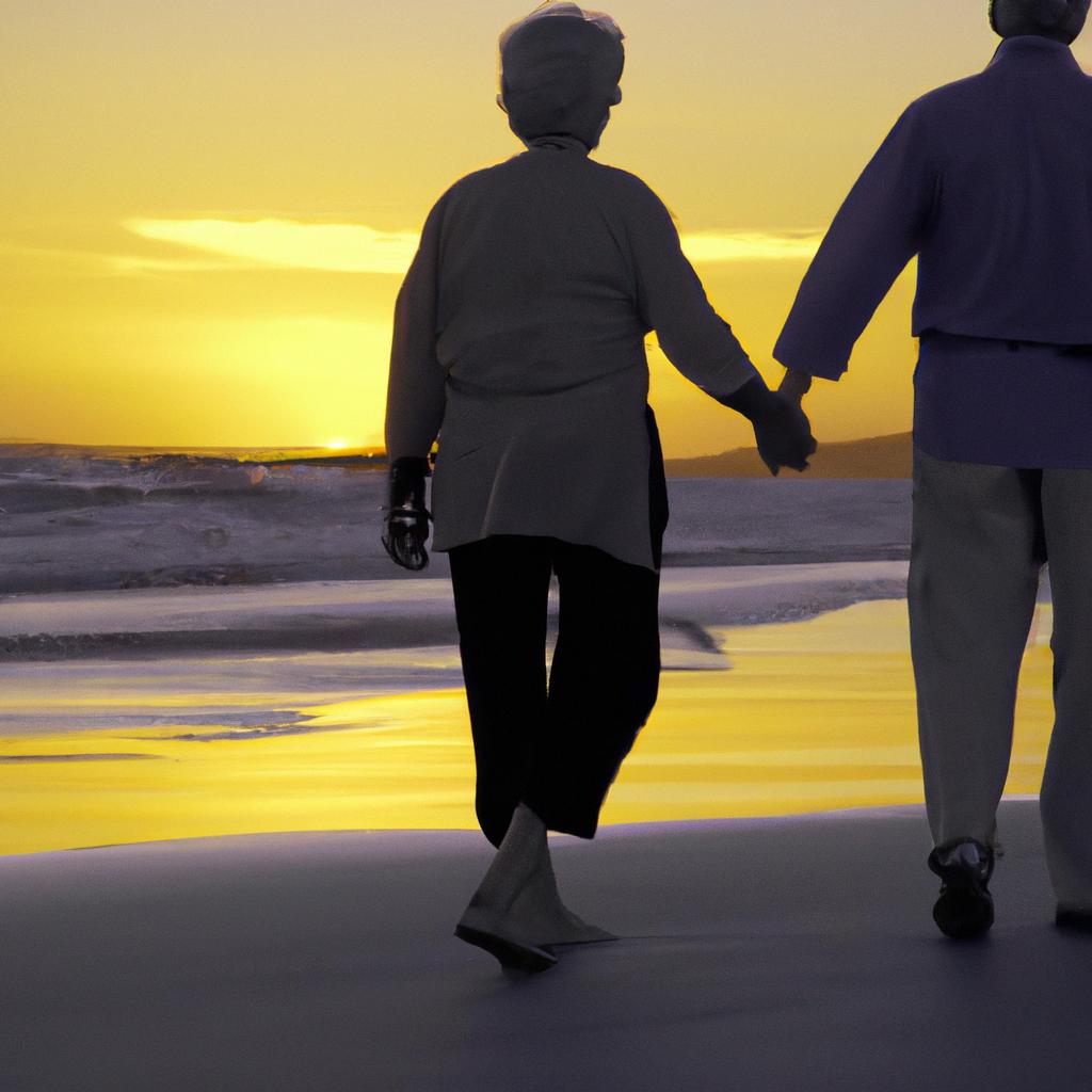 The beauty of growing old together: A senior couple walking hand in hand on a beach at sunset