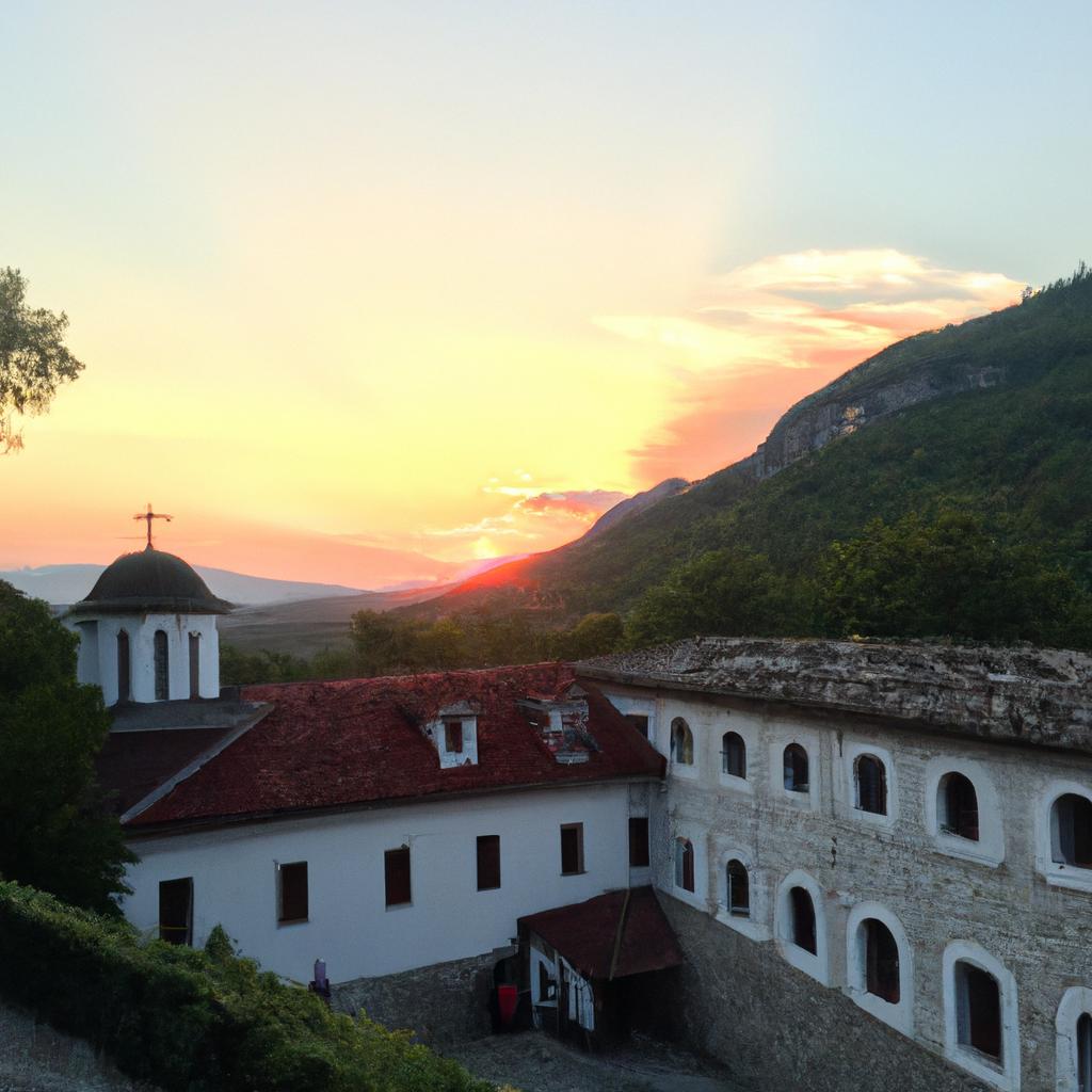 The sunset at Katskhi Monastery is a breathtaking sight, with the orange glow illuminating the surrounding landscape.