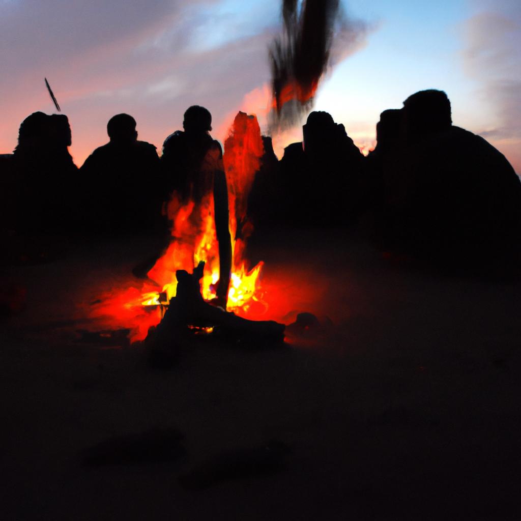 Sentinel Island tribe members gathering around a fire in the evening.