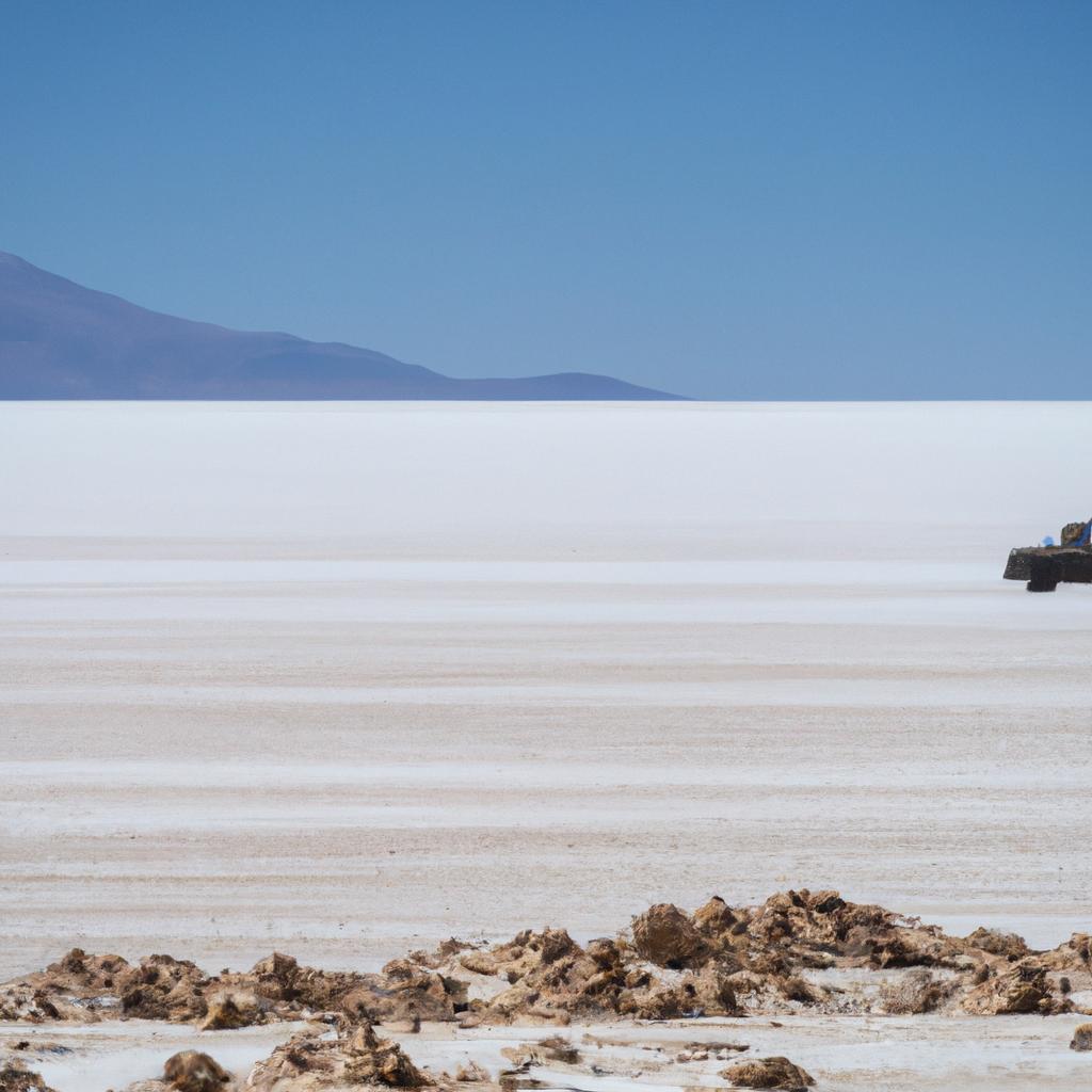 A 4x4 jeep navigates the rugged terrain of the Uyuni desert.