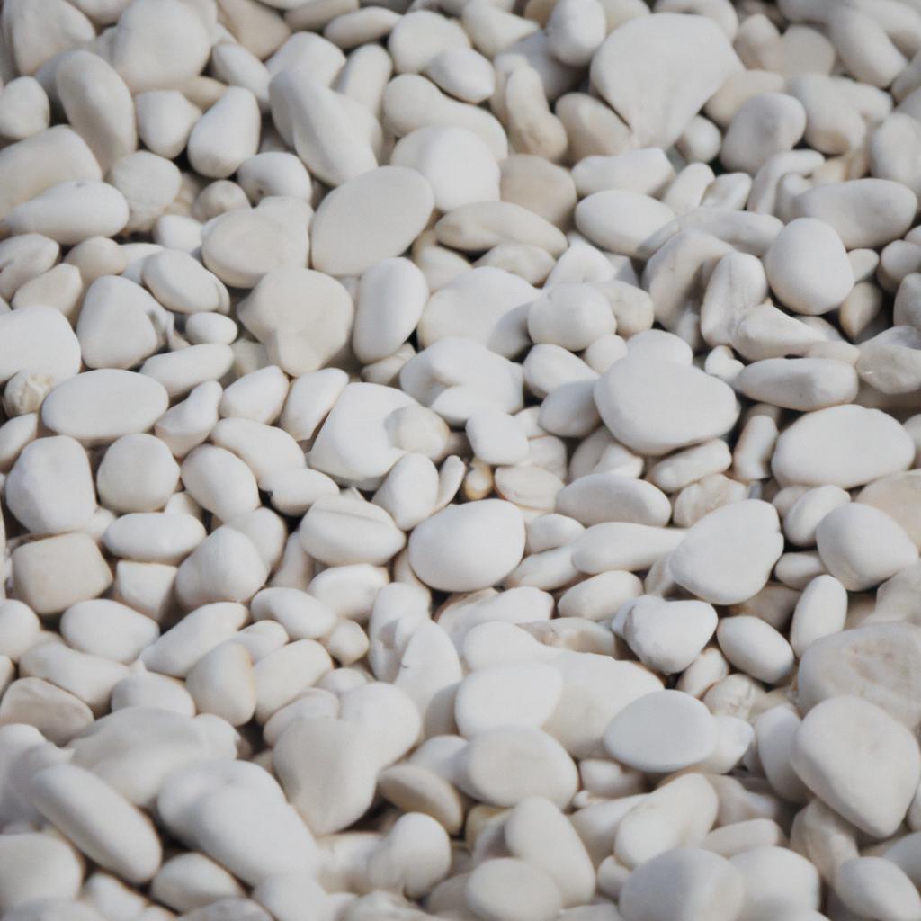 The smooth and shiny white pebbles on Moon Beach in Milos, Greece