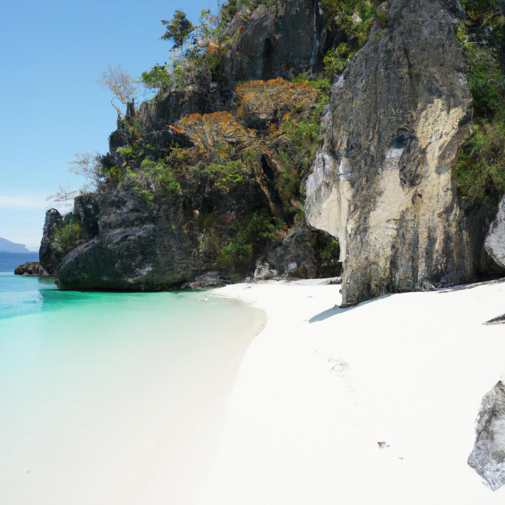 Explore the rocky formations and swim in the clear blue waters of this stunning white sand beach