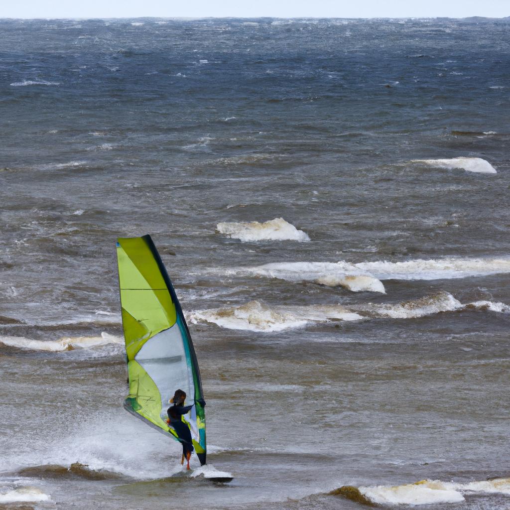 Windsurfer catching some waves on a windy Russian beach.